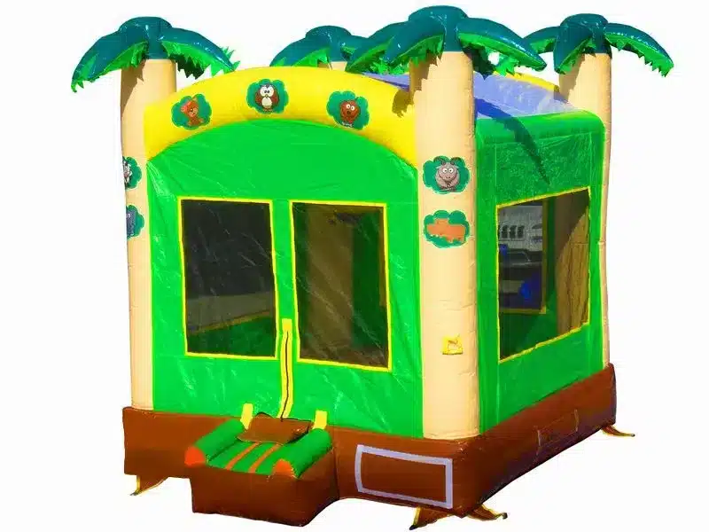 Grey and green castle-themed bouncy castle with pointed turrets, mesh sides, and a small entry ramp. Perfect for kids' events. Buy online in Canada.