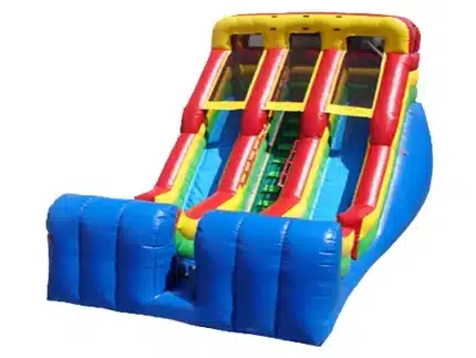 Dual-lane inflatable slide with vibrant blue, red, and yellow design. Perfect for competitive fun at events. Buy online in Canada today!