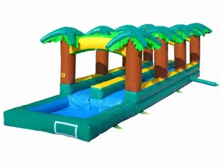Tropical-themed inflatable slip and slide with palm trees and splash pool. Perfect for summer fun and outdoor events. Buy online in Canada today!