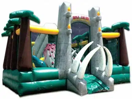 Dinosaur-themed inflatable obstacle course with jungle design, towering tusks, and climbing challenges. Perfect for adventurous events. Buy in Canada now!