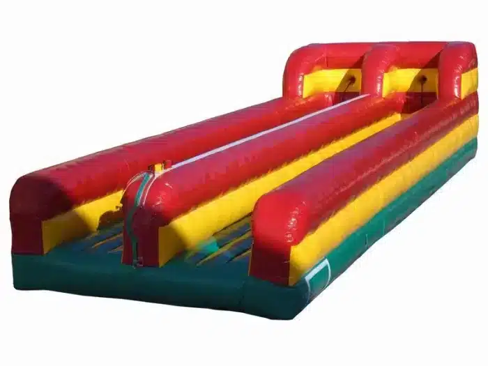 Dual-lane inflatable bungee run with vibrant red, yellow, and green design. Perfect for competitive fun at events. Buy online in Canada today!