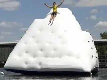 Inflatable iceberg climbing wall with slide, perfect for water adventures and summer fun. Great for lakes. Buy online in Canada today!