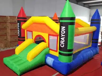 Crayon-themed bouncy castle with colorful design, slide, and mesh sides. Perfect for kids' parties and events. Buy online in Canada today!
