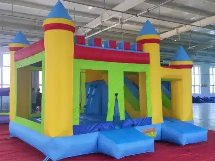 Colorful inflatable bouncy castle with climbing wall, slides, and spacious design. Perfect for kids' parties. Buy online in Canada at affordable prices!